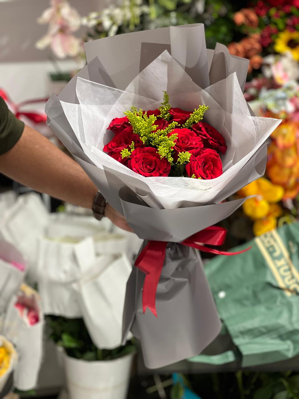 Red roses hand bouquet