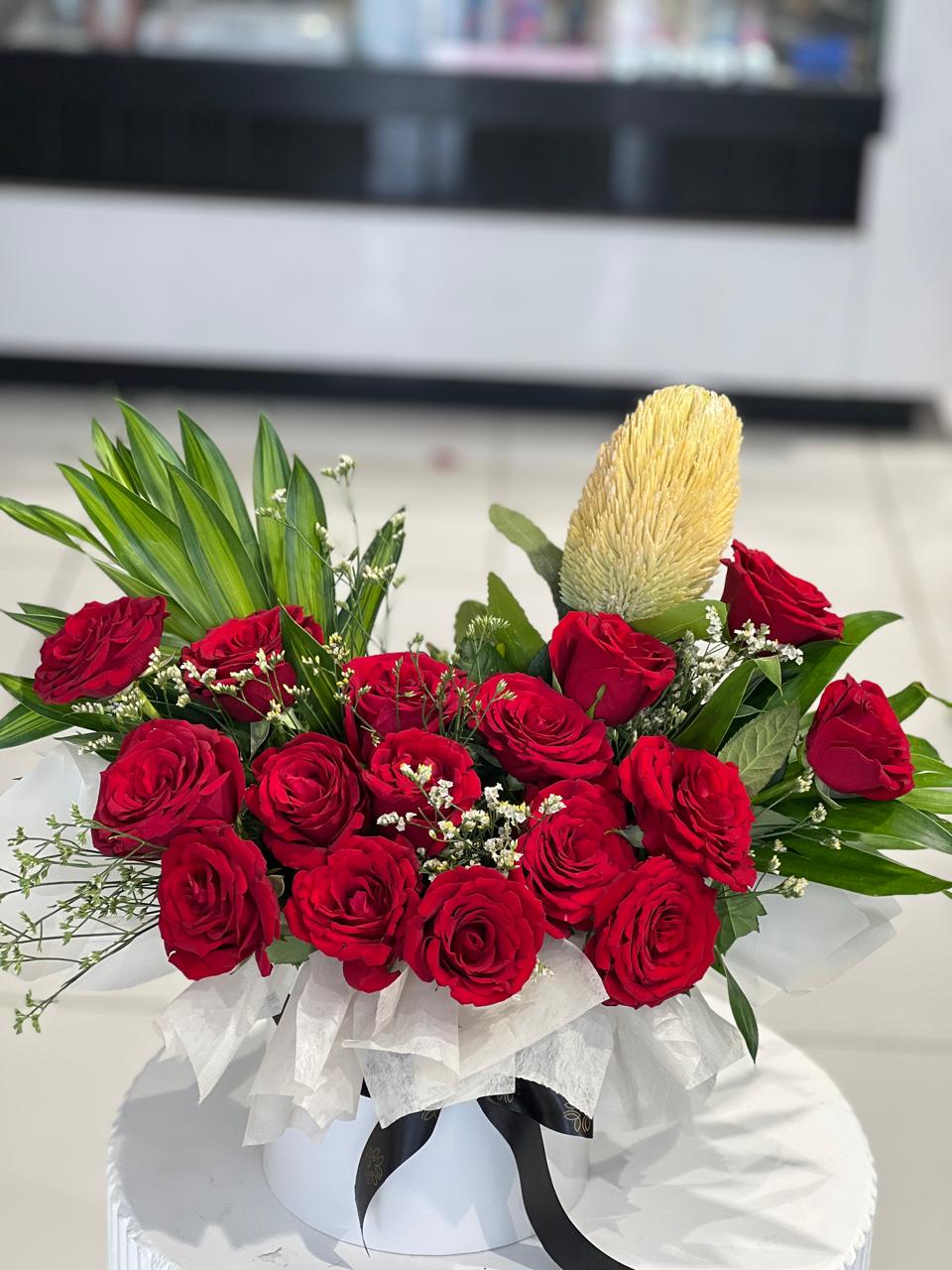 Red roses within box