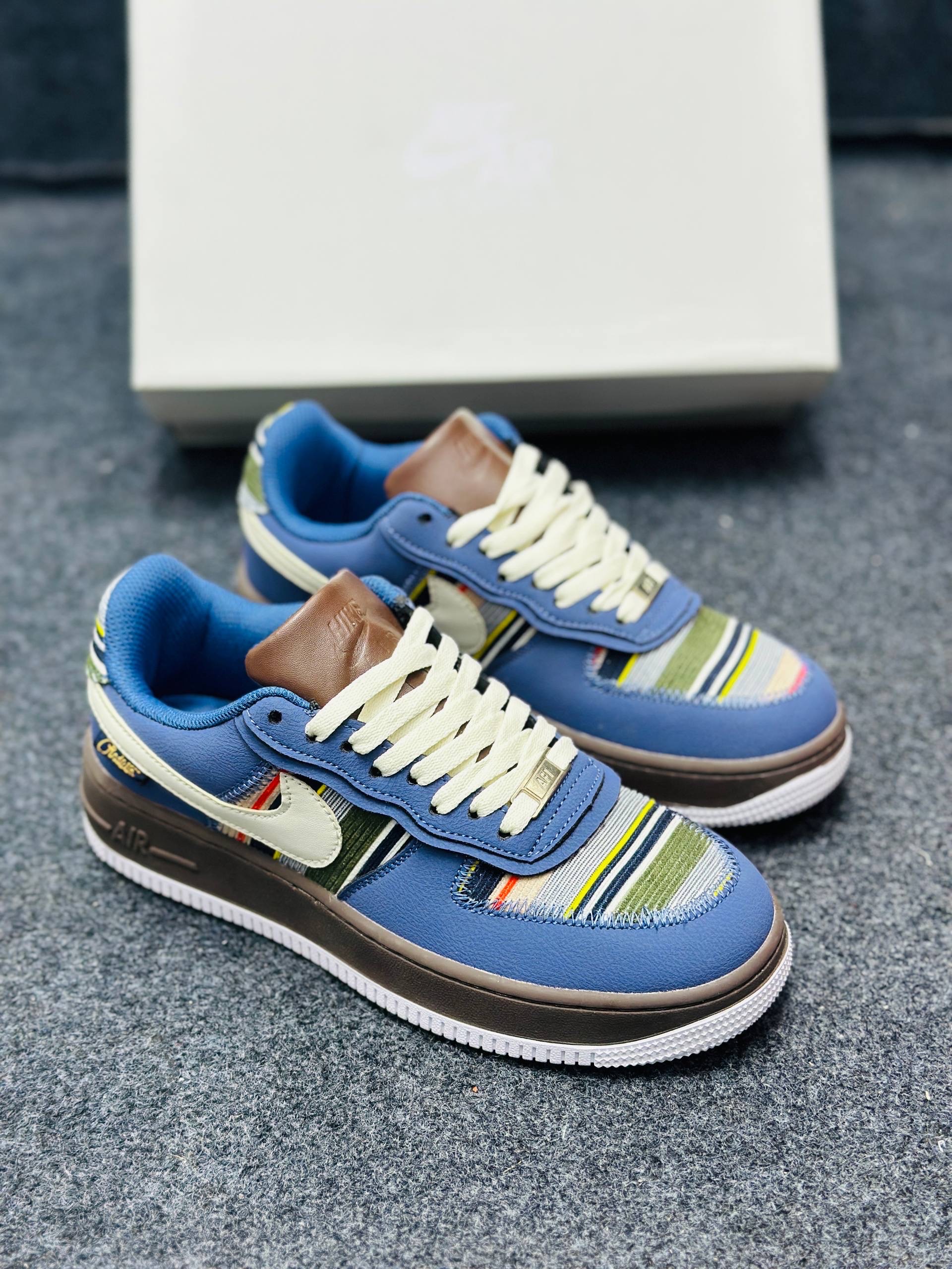 Nike Air Force 1 low: "blue upper, brown midsole, and a multicolor striped textile panel" (1:1) thumbnail 1