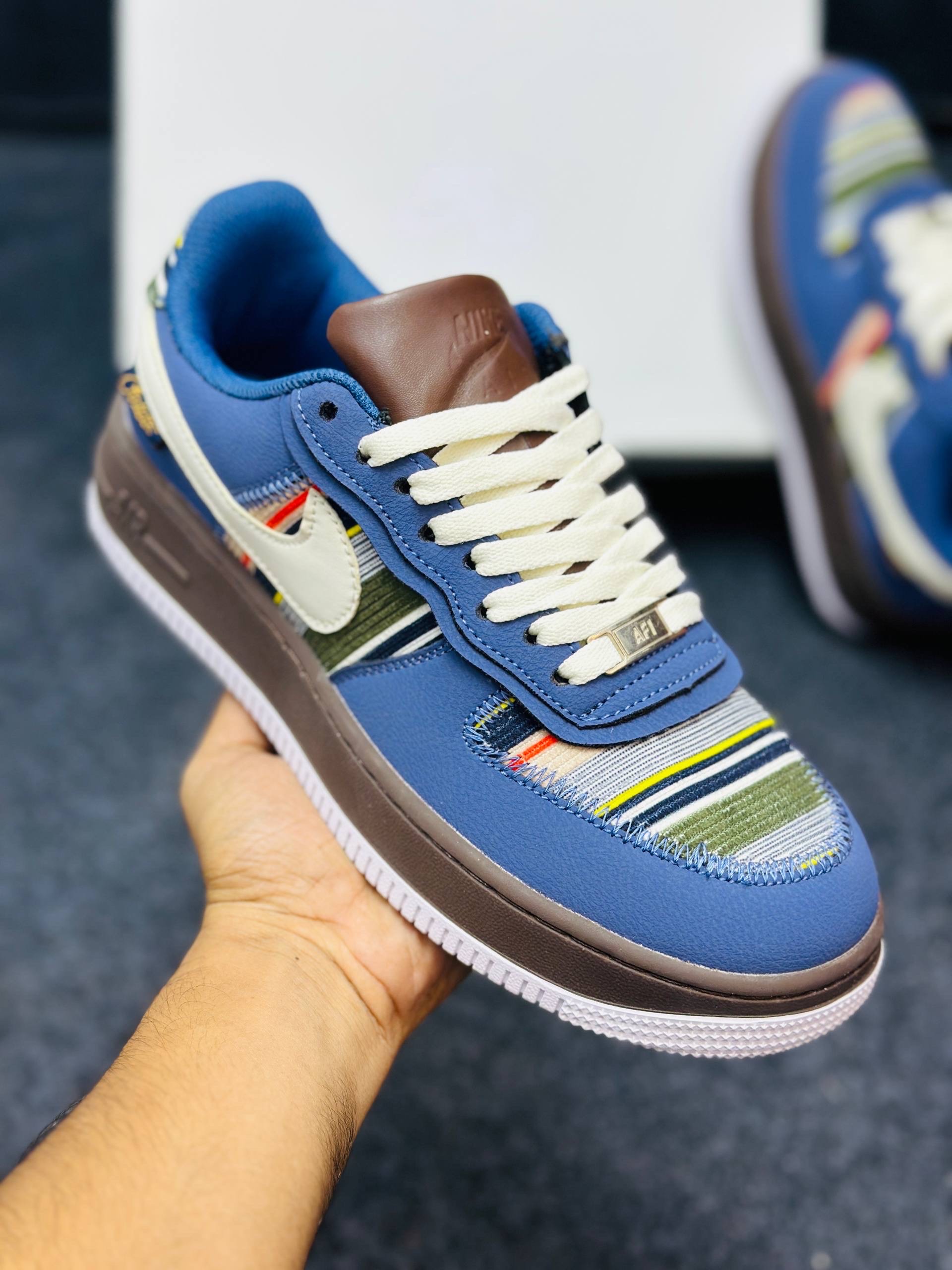 Nike Air Force 1 low: "blue upper, brown midsole, and a multicolor striped textile panel" (1:1) thumbnail 2