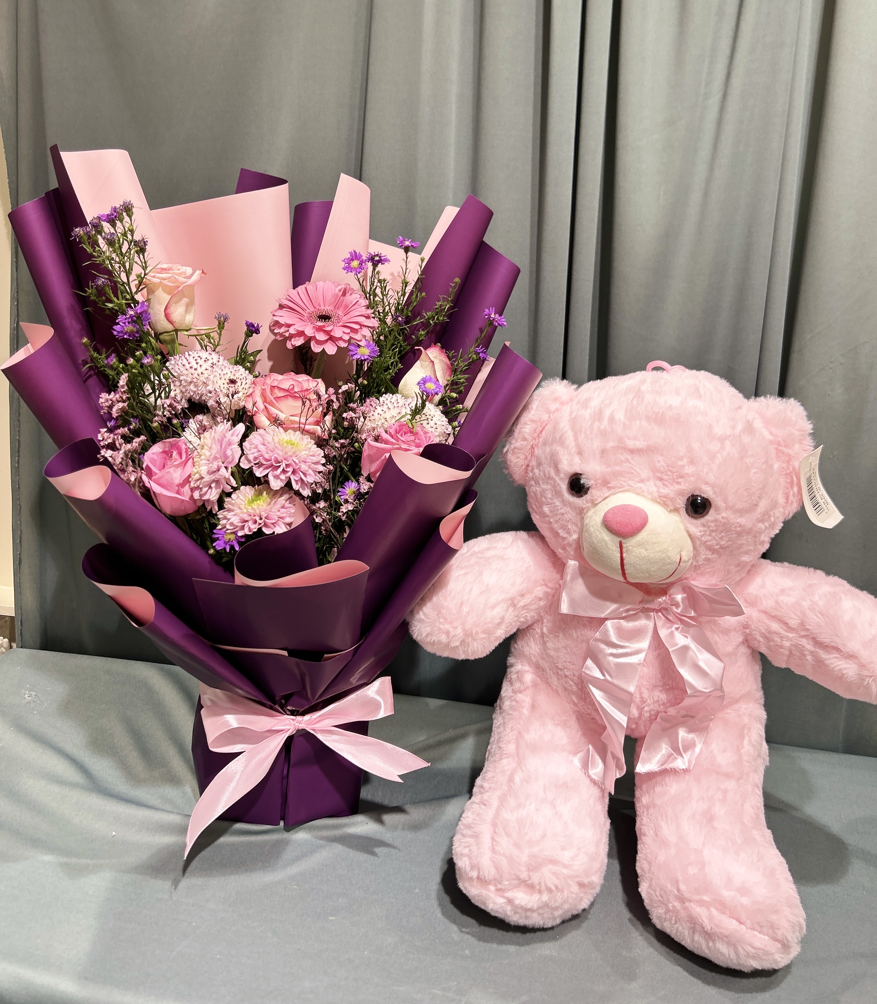 Teddy with  flowers bouquet