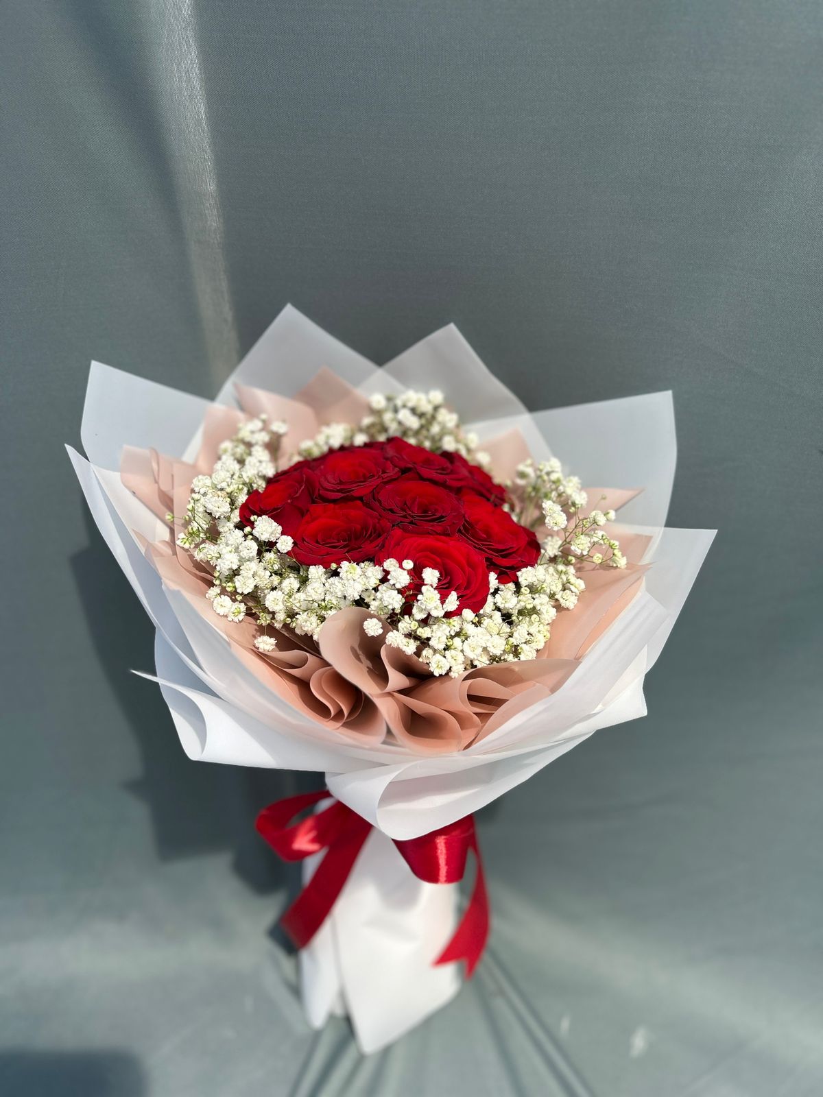 Red roses hand bouquet